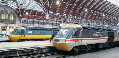  ?? Steve Knight/Creative Commons (CC BY 2.0) ?? HST power car No. 43185 has been stripped for spares to maintain the ScotRail Inter7City fleet. Back in its FGW days, and barely three months after a repaint into BR InterCity Swallow livery, Great Western's lower nose is looking somewhat faded while on the blocks at Paddington on December 16, 2016, next to ‘celebrity' power car No. 43002 Sir Kenneth Grange, now preserved at the NRM, York.