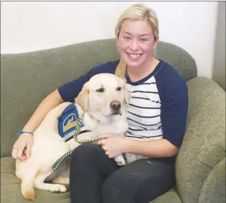  ?? The Associated Press ?? Ivy Jacobsen of Lake Stevens, Wash., is seen with a facility, or comfort, dog. Jacobsen said three facility dogs helped her get through the three trials required before her father was convicted of sexually assaulting her as a teenager. The use of dogs...