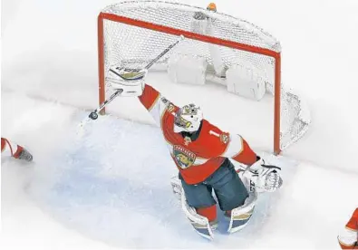  ?? JOEL AUERBACH/GETTY IMAGES ?? Goaltender Roberto Luongo makes a stick save during the third period on Saturday at BB&T Center. He finished the game with 32 total saves.