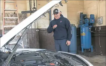  ?? Lake Fong/Post-Gazette ?? Auto mechanic Thomas Beck of South Park, checks a vehicle at Veterans Pro Services in Bethel Park. The company hires and trains veterans for jobs in a number of services.