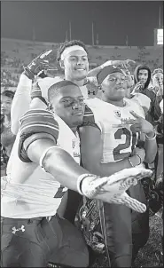  ?? AP/D. ROSS CAMERON ?? Members of the California Golden Bears celebrate after beating No. 8 Washington State 37-3 on Friday night in Berkeley, Calif.