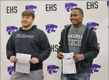  ?? Contribute­d Photo ?? El Dorado duo signs: El Dorado’s Cameron Deal (left) and Carmerius Rucks (right) pose after finalizing their college choices Wednesday. A guard, Deal will be attending Hendrix College, while Rucks, a linebacker, signed to play at Arkansas Tech.