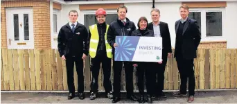  ??  ?? Hot stuff Marking the 1,500th solar panel installati­on are FES project manager Michael Hudson, foreman Harry Bruce, FES divisional manager Ian Mailer, Councillor Violet Weir, housing manager Gregor Wightman and Martin Allman of Sonnen