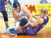  ??  ?? Carlsbad’s Jordane Carrasco, left, and Las Cruces’ Sarah Abney battle for a loose ball during their game at the Santa Ana Star Center on Tuesday.