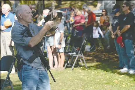  ?? NWA Democrat-Gazette/Andy Shupe ?? Richard “Bigo” Barnett videos a procession of officials walking Wednesday, Oct. 7, 2020, during a ceremony to welcome the Patriots, God and Country Tour to the area at the Veterans Wall of Honor in Bella Vista.