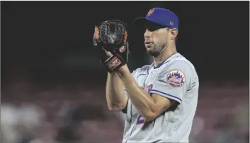  ?? AP PHOTO/AARON DOSTER ?? New York Mets’ Max Scherzer prepares to throw a pitch during the fifth inning of the team’s baseball game against the Cincinnati Reds in Cincinnati, on July 5.