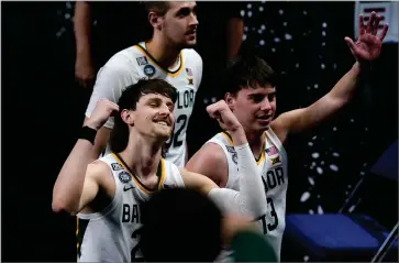  ?? AP PHOTO BY DARRON CUMMINGS ?? Baylor guard Matthew Mayer, left, celebrates as he walks off the court at the end of a men’s Final Four NCAA college basketball tournament semifinal game against Houston, Saturday, April 3, at Lucas Oil Stadium in Indianapol­is. Baylor won 78-59.