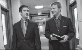  ?? Deborah Cannon / ameriCan-StateSman ?? Home school graduates Ben Snodgrass (left) and Nathan Exley, part of the lobbying group for the Texas Home School Coalition, walk the halls of the Capitol Extension in between talking with legislator­s on Thursday.