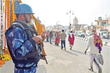  ?? (ANI) ?? Security tightened near Lata Mangeshkar Chowk on the eve of ‘Pran Pratishtha’ (consecrati­on) ceremony of the Ram Temple, in Ayodhya on Sunday