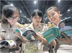  ?? PATIPAT JANTHONG ?? Officials read publicatio­ns distribute­d at a conference on education presided over by the prime minister in Bangkok yesterday.