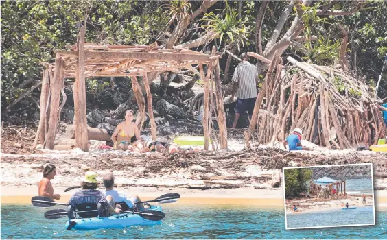  ??  ?? Tallebudge­ra Creek beachgoers have been getting creative with driftwood deposited along the shoreline after recent floods. Pictures: Glenn Hampson