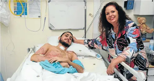  ?? Picture: Thapelo Morebudi ?? Leigh van Baalen and her son Kelvin, who suffered severe burns in a paraglidin­g accident. Her medical scheme will fund only 10 days of rehabilita­tion.