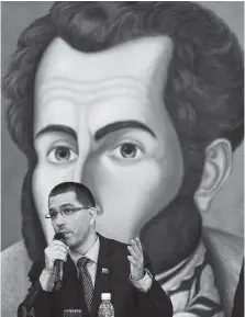  ?? THE ASSOCIATED PRESS ?? Venezuela Foreign Minister Jorge Arreaza speaks Saturday during a meeting with the diplomatic corps at his offices in Caracas. The picture in the background is the Venezuelan hero Simon Bolivar.