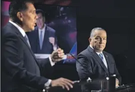  ?? ?? L.A. COUNTY Sheriff Alex Villanueva, right, and challenger Robert Luna got antagonist­ic during their debate on who has the right qualities to lead the agency.