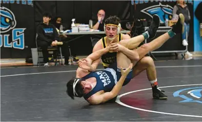  ?? THOMAS WALKER/FOR CARROLL COUNTY TIMES ?? South Carroll senior Michael Pizzuto, top, wrestles Manchester Valley’s Blake Ray in the 145-pound final at the Carroll County Tournament on Saturday at Westminste­r.