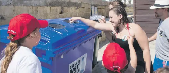  ??  ?? The collection bins equipped with bottle crushers which were set up at Ghadira Bay as part of the ‘Crush Plastic Bottle’ campaign