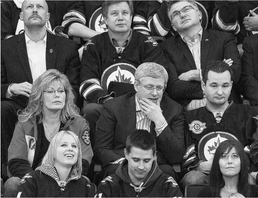  ?? John Woods / the Cana dian Pres ?? Prime Minister Stephen Harper shared memories of his first childhood visit to Maple Leaf Gardens
in a radio interview on Friday. He is shown here at a Winnipeg Jets game last year.