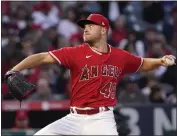  ?? MARK J. TERRILL – THE ASSOCIATED PRESS ?? Angels starter Reid Detmers allowed five runs in six innings to take the loss against the visiting Rangers on Wednesday.