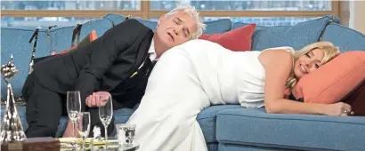  ??  ?? This Morning after the night before: Phillip and Holly Willoughby mess about after an awards do