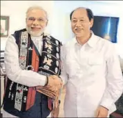  ?? HT FILE ?? PM Narendra Modi (left) shakes hands with former Nagaland chief minister Neiphiu Rio. With current CM TR Zeliang, the three are the most important players in the assembly polls in the state.