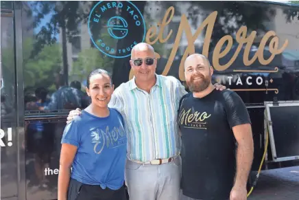  ?? FOOD NETWORK ?? Jacob and Clarissa Dries, owners of El Mero Taco pose for a portrait with Andrew Zimmern, as seen on Big Food Truck Tip, Season 1.
