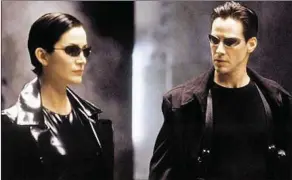  ??  ?? Carrie-Anne Moss and Keanu Reevs in TheMatrix (Wednesday, ITV4, 10p.m.)