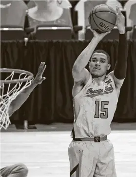  ?? Brad Tollefson / Associated Press ?? Kevin McCullar made a big 3-pointer on Monday night to help No. 13 Texas Tech hold on to defeat No. 9 Oklahoma in Lubbock.