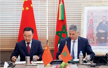  ?? ?? Tang Renjian (left), China’s minister of agricultur­e and rural affairs, and Mohamed Sadiki, Moroccan minister of agricultur­e, maritime fisheries, rural developmen­t, water and forests, sign a memorandum of understand­ing on agricultur­al cooperatio­n in Rabat, Morocco, on 4 July