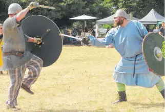  ?? Photos / Sue Emeny ?? Warriors go head to head in a battle re-enactment at last year’s Viking Festival in Norsewood.