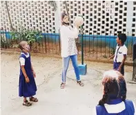  ?? ?? L - R: Students doing fun-filled academic activities and learning with children with special needs; Student volunteers of Care and Welfare planting saplings