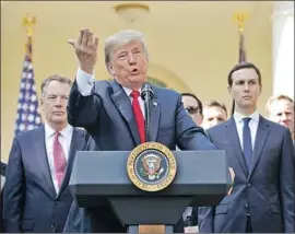  ?? Chip Somodevill­a Getty Images ?? PRESIDENT TRUMP, at a news conference, bristled at those who said the deal largely amounted to an update. “It’s not NAFTA redone. It’s a brand-new deal.”