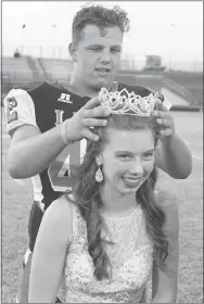  ?? Photo by Randy Moll ?? Hailee Gerner, a senior, was crowned queen by Colton Grimes at Gravette homecoming ceremonies on the field at Lion Stadium Friday night.