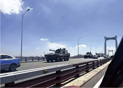  ?? The Yomiuri Shimbun ?? Military vehicles are seen in this image from a Chinese social media platform, believed to be a photo taken in the southeaste­rn Chinese city of Xiamen in Fujian Province.