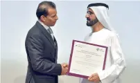  ??  ?? Sheikh Mohammed congratula­tes founder and chairman of GEMS Education Sunny Varkey for his contributi­on to Dubai Cares.