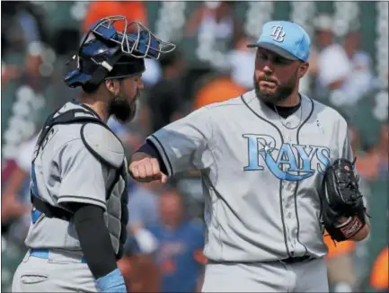  ?? DUANE BURLESON - THE ASSOCIATED PRESS FILE ?? In this June 18, 2017, photo, Tampa Bay Rays reliever Tommy Hunter celebrates with catcher Derek Norris after a 9-1 win over the Detroit Tigers. New Phillies reliever Hunter helped the team land pitcher Jake Arrieta, a friend of Hunter’s since college.