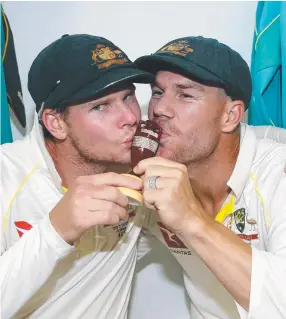  ?? KISS GOODBYE: Steve Smith and David Warner celebrate after Australia regained the Ashes after the Third Test match during the 2017- 18 Ashes Series. ??