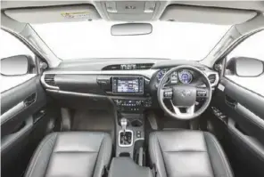  ??  ?? For the latest generation HiLux Toyota has spruced up the interior. There’s a more sophistica­ted and modern dash design meshing in with appealing door trims, and a fresh “high grade” seat upholstery.