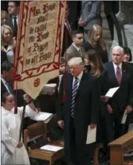  ?? MANUEL BALCE CENETA – ASSOCIATED PRESS ?? President Donald Trump, first lady Melania Trump and Vice President Mike Pence, second from right, and his wife Karen, right, attend a National Prayer Service at the National Cathedral, in Washington, D.C. Saturday.