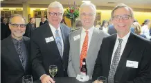  ??  ?? More than 700 guests attended the dinner. Pictured, from left, are Royop Developmen­t Corporatio­n vice-chairman Brian Kowall, West Canadian Industries’ George Brookman, Oakridge Investment­s’ Milt Hohol and Royop president and CEO Melvin Foht.