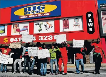  ?? Picture: FREDLIN ADRIAAN ?? RED BRIGADE: EFF members support Big Bucks employees in their protest for better pay