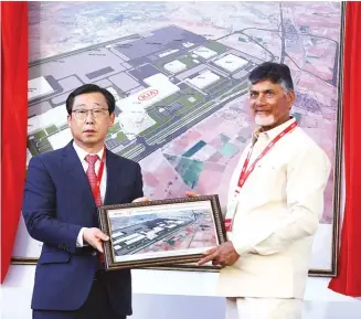  ??  ?? Han Woo Park, president and CEO, Kia Motors, with Chandrabab­u Naidu, CM Andhra Pradesh, at the framework installati­on ceremony in Anantpur district, AP