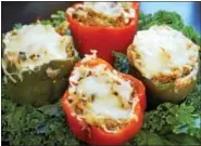  ??  ?? These gluten-free stuffed peppers include quinoa.