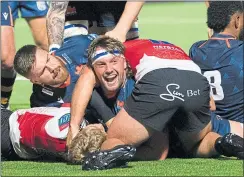  ?? ?? Edinburgh’s Ben Muncaster celebrates after scoring a second-half try on Friday night