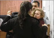  ?? OREN ZIV / AP ?? Palestinia­n teen Ahed Tamimi is escorted Wednesday at a military court near Jerusalem. She was arrested three days after confrontin­g two soldiers in a melee caught on video that has been widely watched.