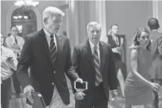  ?? PABLO MARTINEZ MONSIVAIS, AP ?? Sen. Bill Cassidy, left, and Sen. Lindsey Graham would get rid of the individual and employer mandates.