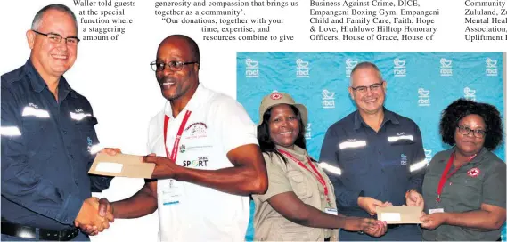  ?? ?? Bheki Mngomezulu of Empangeni Boxing Gym Centre is thrilled with the support of RBCT
Nokuthula Mkize and Macrina Thwalo of the SA Red Cross receive their donation from Alan Waller