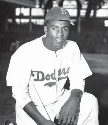  ?? Associated Press ?? In this photo from April 11, 1947, Jackie Robinson joins the Brooklyn Dodgers at Ebbets Field in Brooklyn. Robinson’s historic contract with the Brooklyn Dodgers broke Major League Baseball’s color barrier 70 years ago.