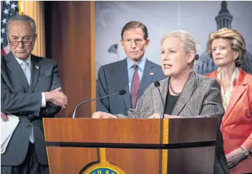  ?? NYT ?? Kirsten Gillibrand speaks as Chuck Schumer, left, looks on during a news conference on a planned Senate vote on legislatio­n that would enshrine abortion rights into federal law in Washington on Thursday.