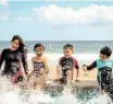  ?? ?? A FAMILY enjoying some time at the beach. | Pexels