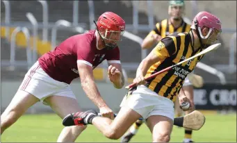  ??  ?? Daithí Waters (St. Martin’s) tries to halt the progress of Conor Hearne (Shelmalier­s) in their SHC tie.